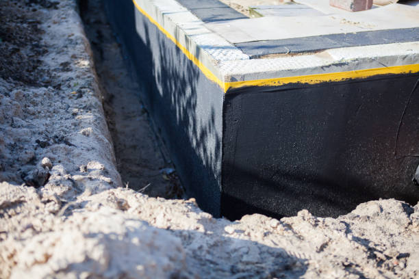 Professional Basement Waterproofing technician working in Clay City, KY